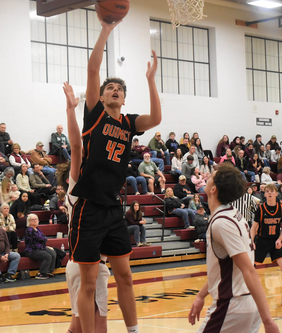 Quincy's Alex Dunn (42) goes up for an easy two versus Union City on February 13, 2026