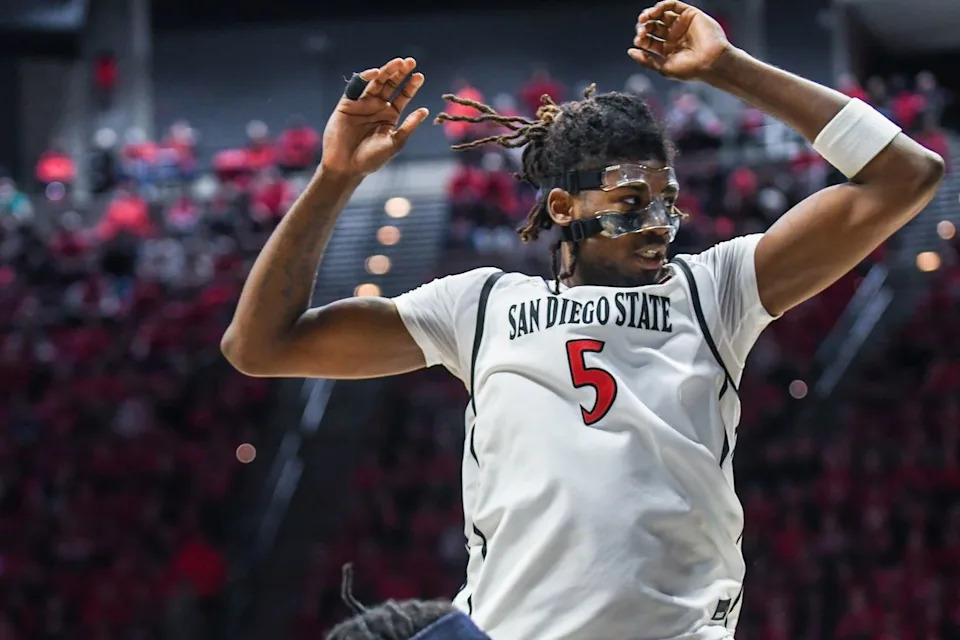 SDSU forward Pharaoh Compton (5) leaps for the rebound during an NCAA Basketball game against Nevada Saturday February 14, 2026 in California.