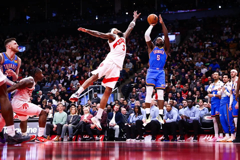 TORONTO, CANADA - FEBRUARY 24: Luguentz Dort #5 of the Oklahoma City Thunder puts up a shot over Brandon Ingram #3 of the Toronto Raptors during the second half of their NBA game at Scotiabank Arena on February 24, 2026 in Toronto, Ontario, Canada. NOTE TO USER: User expressly acknowledges and agrees that, by downloading and or using this photograph, User is consenting to the terms and conditions of the Getty Images License Agreement. (Photo by Cole Burston/Getty Images)
