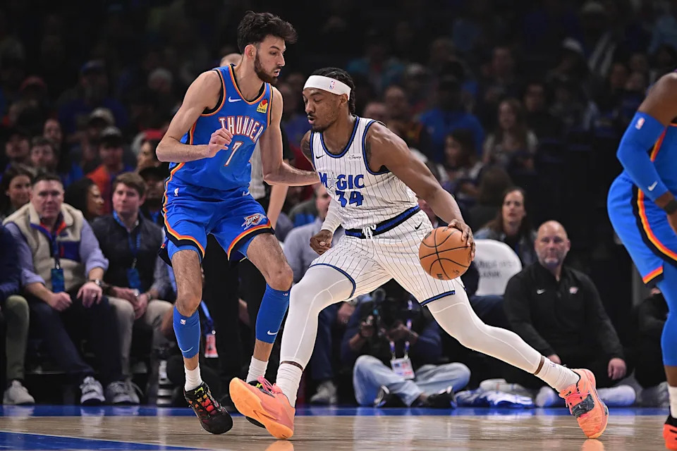 OKLAHOMA CITY, OKLAHOMA - FEBRUARY 3: Wendell Carter Jr. #34 of the Orlando Magic attempts to drive the ball past Chet Holmgren #7 of the Oklahoma City Thunder during the first half at Paycom Center on February 3, 2026 in Oklahoma City, Oklahoma. NOTE TO USER: User expressly acknowledges and agrees that, by downloading and or using this photograph, User is consenting to the terms and conditions of the Getty Images License Agreement. (Photo by Joshua Gateley/Getty Images)