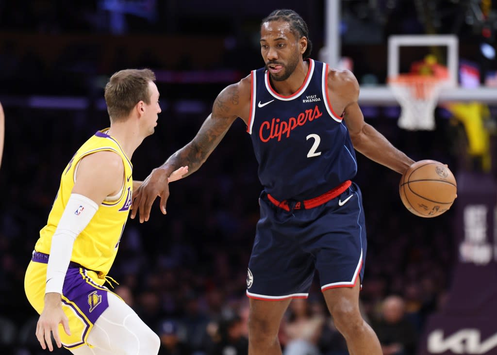 Kawhi Leonard, making a move on Luke Kennard, scored 31 points before exiting with left ankle soreness in the Clippers’ loss to the Lakers. Getty Images