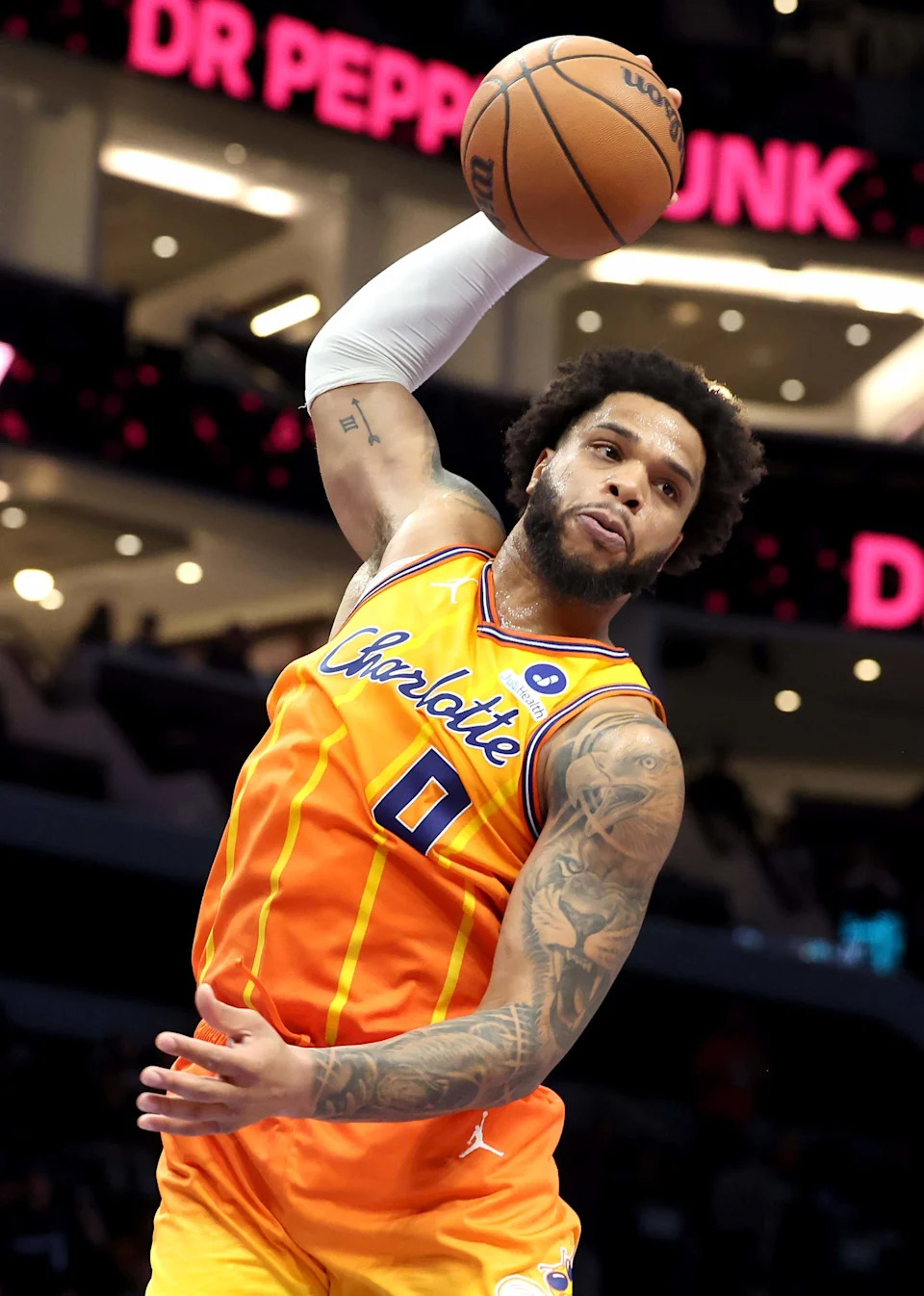 Charlotte Hornets forward Miles Bridges grabs a rebound Saturday in the win over San Antonio.