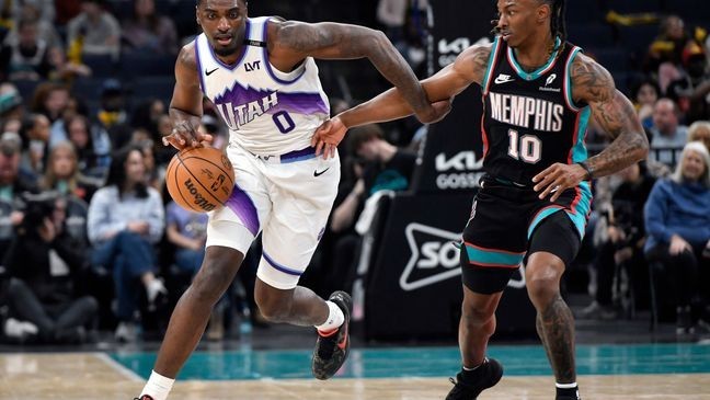 Utah Jazz guard Vince Williams Jr. (0) brings the ball upcourt against Memphis Grizzlies guard Javon Small (10) in the first half of an NBA basketball game Friday, Feb. 20, 2026, in Memphis, Tenn. (AP Photo/Brandon Dill)