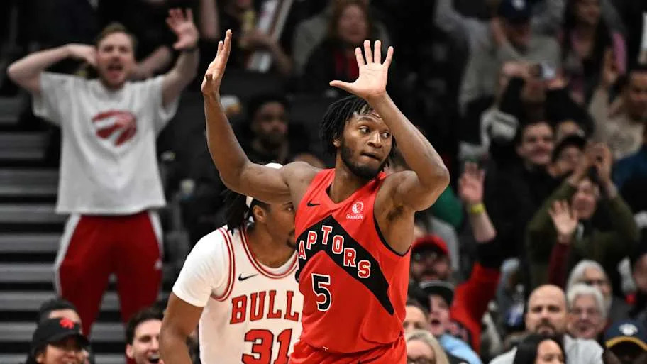 Toronto Raptors guard Immanuel Quickley reacts after making a three point basket against the Chicago Bulls