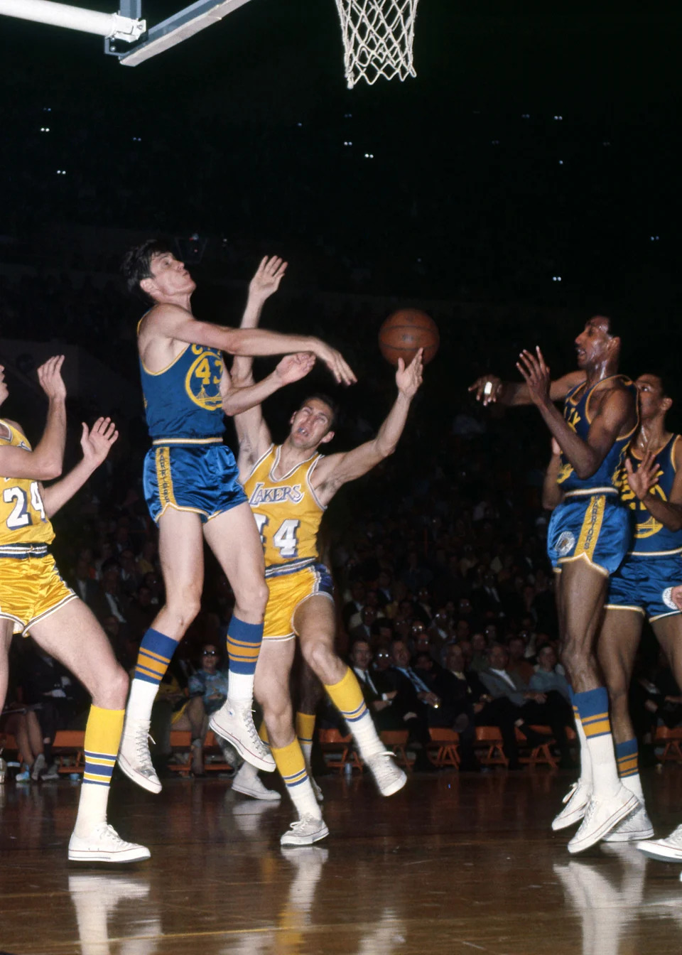 Unknown date; Los Angeles, CA, USA; FILE PHOTO; San Francisco Warriors center Clyde Lee (43) is defended by Los Angeles Lakers guard Jerry West (44) at the Forum. Mandatory Credit: Darryl Norenberg-USA TODAY Sports