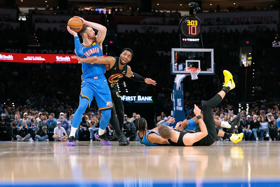 OKLAHOMA CITY, OKLAHOMA - FEBRUARY 22: Isaiah Hartenstein #55 of the Oklahoma City Thunder protects the ball from Donovan Mitchell #45 of the Cleveland Cavaliers during the second half at Paycom Center on February 22, 2026 in Oklahoma City, Oklahoma. NOTE TO USER: User expressly acknowledges and agrees that, by downloading and or using this photograph, User is consenting to the terms and conditions of the Getty Images License Agreement. (Photo by William Purnell/Getty Images)