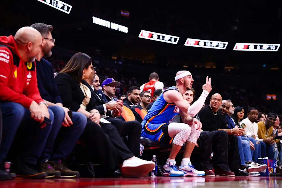 TORONTO, CANADA - FEBRUARY 24: Alex Caruso #9 of the Oklahoma City Thunder reacts from a fan's seat during the first half of their NBA game against the Toronto Raptors at Scotiabank Arena on February 24, 2026 in Toronto, Ontario, Canada. NOTE TO USER: User expressly acknowledges and agrees that, by downloading and or using this photograph, User is consenting to the terms and conditions of the Getty Images License Agreement. (Photo by Cole Burston/Getty Images)