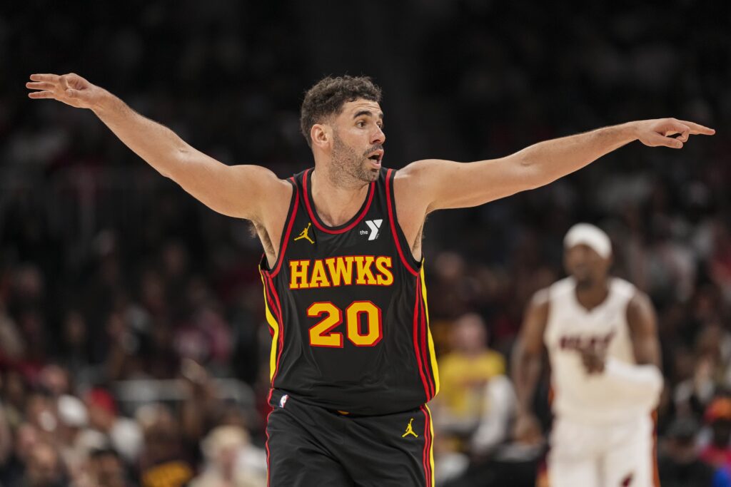 Apr 18, 2025; Atlanta, Georgia, USA; Atlanta Hawks forward Georges Niang (20) reacts after making a three point shot against the Miami Heat during the second half at State Farm Arena. Mandatory Credit: Dale Zanine-Imagn Images