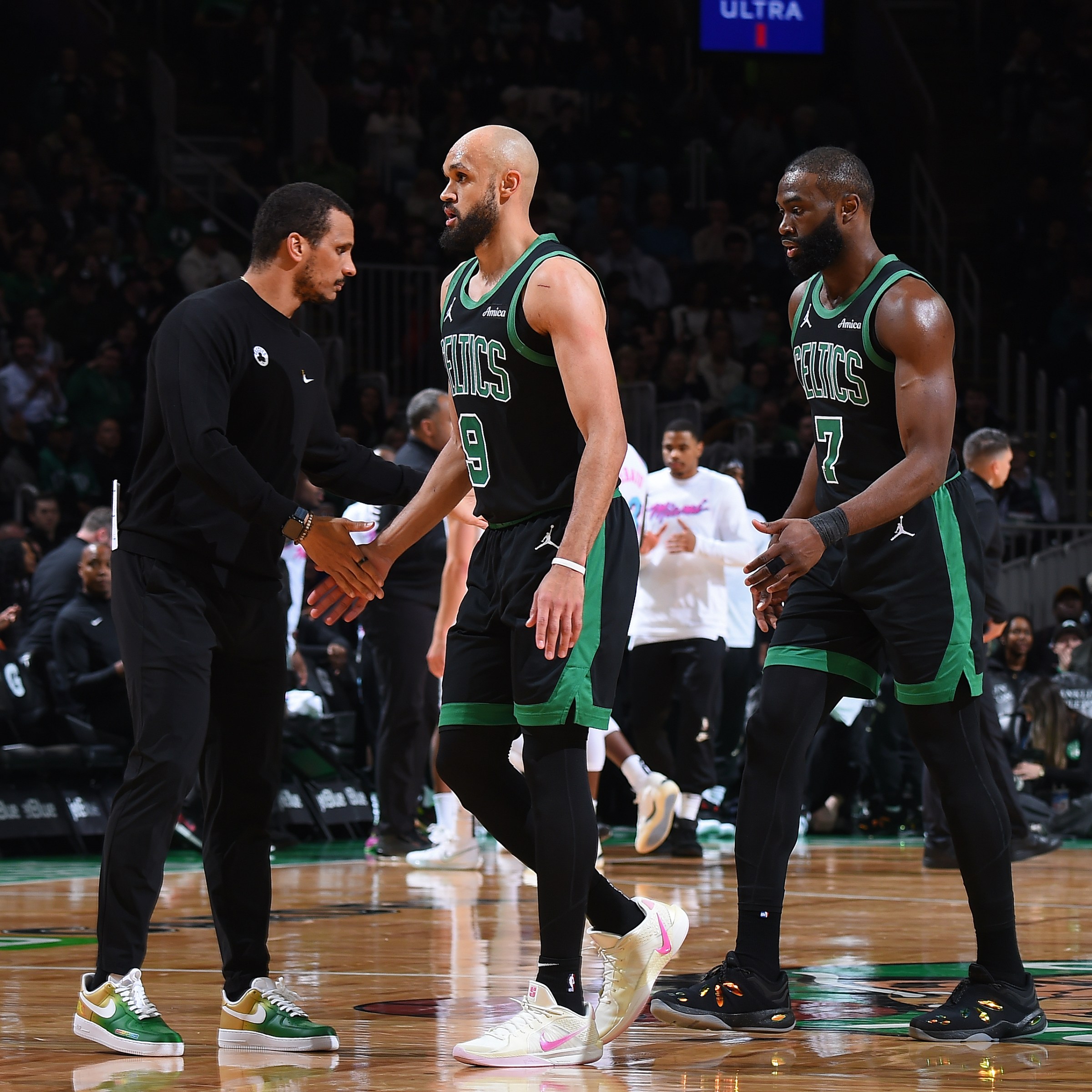 BOSTON, MA - APRIL 2: Head Coach Joe Mazzulla of the Boston Celtics high fives Derrick White #9 and Jaylen Brown #7 during the game against the Miami Heat on April 2, 2025 at TD Garden in Boston, Massachusetts. NOTE TO USER: User expressly acknowledges and agrees that, by downloading and/or using this Photograph, user is consenting to the terms and conditions of the Getty Images License Agreement. Mandatory Copyright Notice: Copyright 2025 NBAE(Photo by Brian Babineau/NBAE via Getty Images)