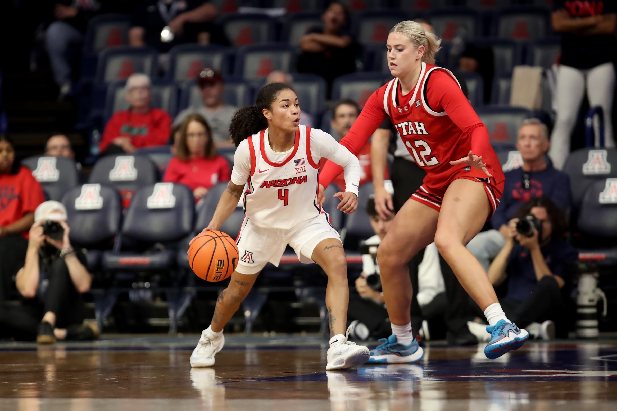 TUCSON, AZ - DECEMBER 22: Utah Utes forward Chyra Evans (12) and Arizona Wildcats guard Noelani Cornfield (4) during a women’s basketball game between the Utah Utes and the Arizona Wildcats on December 22, 2025, at McKale Center in Tucson, AZ. (Photo by Christopher Hook/Icon Sportswire via Getty Images)