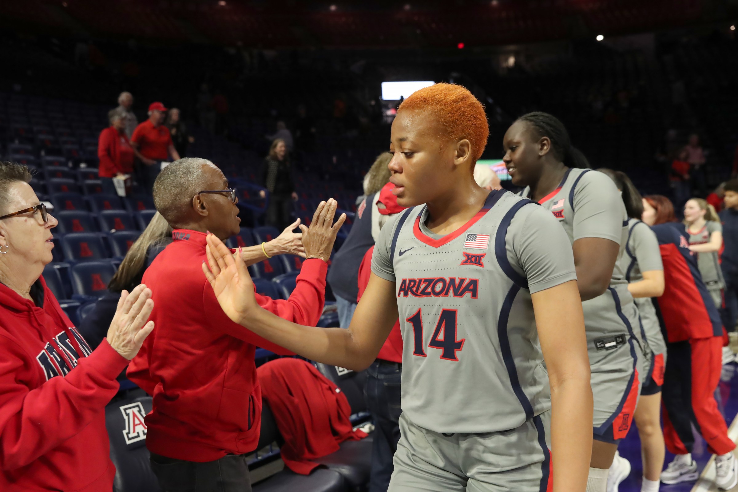 TUCSON, AZ - JANUARY 20: Arizona Wildcats forward Blessing Adebanjo (14) with fans after a women’s basketball game between the Kansas Jayhawks and the Arizona Wildcats on January 20, 2026, at McKale Center in Tucson, AZ. (Photo by Christopher Hook/Icon Sportswire via Getty Images)