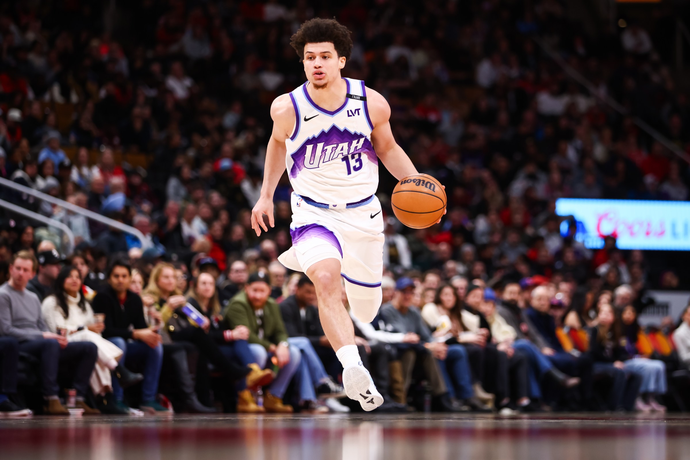 TORONTO, CANADA - FEBRUARY 1: Walter Clayton Jr. #13 of the Utah Jazz dribbles up court against the Toronto Raptors during the second half of their NBA game at Scotiabank Arena on February 1, 2026 in Toronto, Ontario, Canada. NOTE TO USER: User expressly acknowledges and agrees that, by downloading and or using this photograph, User is consenting to the terms and conditions of the Getty Images License Agreement. (Photo by Cole Burston/Getty Images)