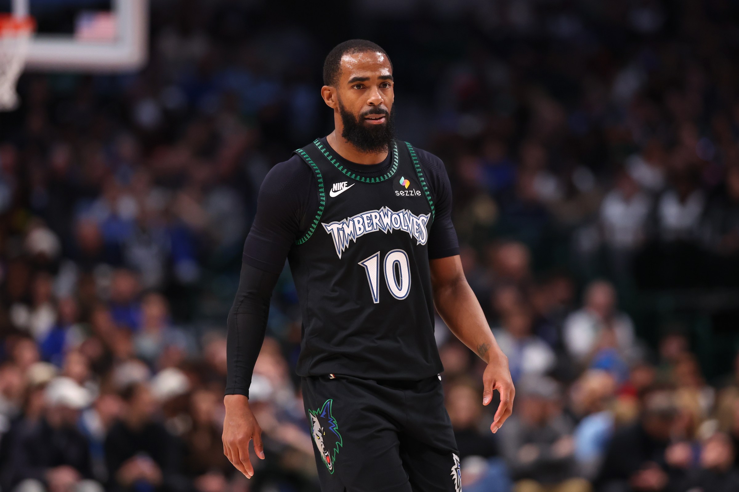 DALLAS, TEXAS - JANUARY 28: Mike Conley #10 of the Minnesota Timberwolves looks on during the second half against the Dallas Mavericks at American Airlines Center on January 28, 2026 in Dallas, Texas. NOTE TO USER: User expressly acknowledges and agrees that, by downloading and or using this photograph, user is consenting to the terms and conditions of the Getty Images License Agreement. (Photo by Sam Hodde/Getty Images)