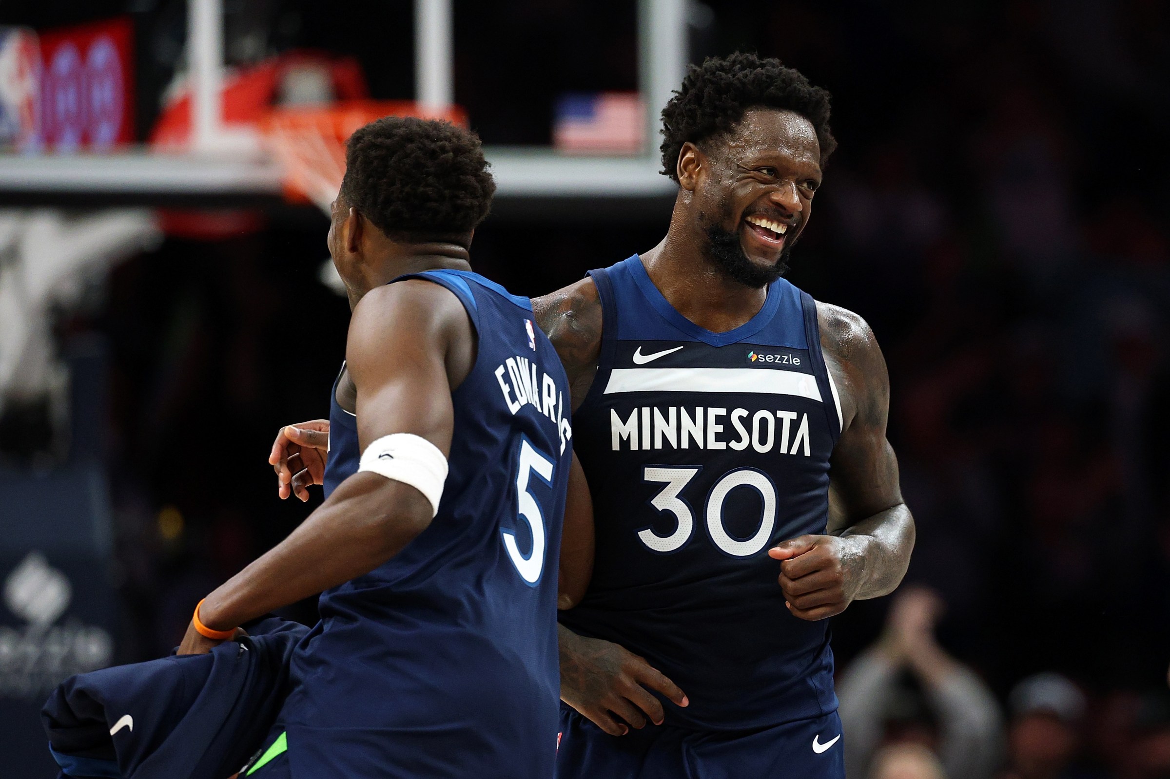 MINNEAPOLIS, MINNESOTA - FEBRUARY 11: Julius Randle #30 of the Minnesota Timberwolves celebrates with teammate Anthony Edwards #5 in the fourth quarter against the Portland Trail Blazers at Target Center on February 11, 2026 in Minneapolis, Minnesota. The Timberwolves defeated the Trail Blazers 133-109. NOTE TO USER: User expressly acknowledges and agrees that, by downloading and or using this photograph, User is consenting to the terms and conditions of the Getty Images License Agreement. (Photo by David Berding/Getty Images)