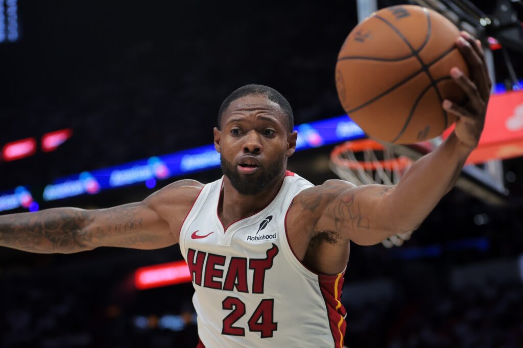 Apr 28, 2025; Miami, Florida, USA; Miami Heat forward Haywood Highsmith (24) reaches for the basketball to prevent it from going out of bounds against the Cleveland Cavaliers in the second quarter during game four for the first round of the 2025 NBA Playoffs at Kaseya Center. Mandatory Credit: Sam Navarro-Imagn Images