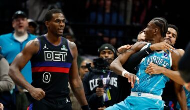 Charlotte Hornets forward Moussa Diabaté, front right, is held back as he fights Detroit Pistons center Jalen Duren (0) on the court in the second half of an NBA basketball game in Charlotte, N.C., on Monday, Feb. 9, 2026. (AP Photo/Nell Redmond)