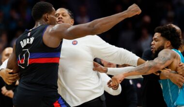 Detroit Pistons center Jalen Duren, left, throws punches with Charlotte Hornets forward Miles Bridges, right, during a fight on the court in the second half of an NBA basketball game in Charlotte, N.C., Monday, Feb. 9, 2026. (AP Photo/Nell Redmond)