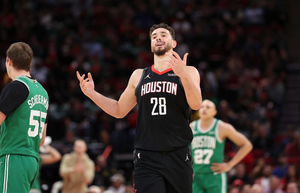 Houston Rockets center Alperen Sengun reacting during a game against the Boston Celtics.