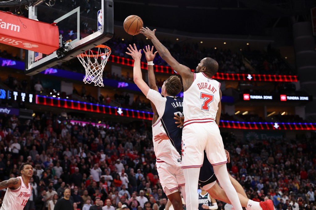Houston Rockets forward Kevin Durant (7) defends a shot by Dallas Mavericks forward Cooper Flagg (32) during a basketball game.