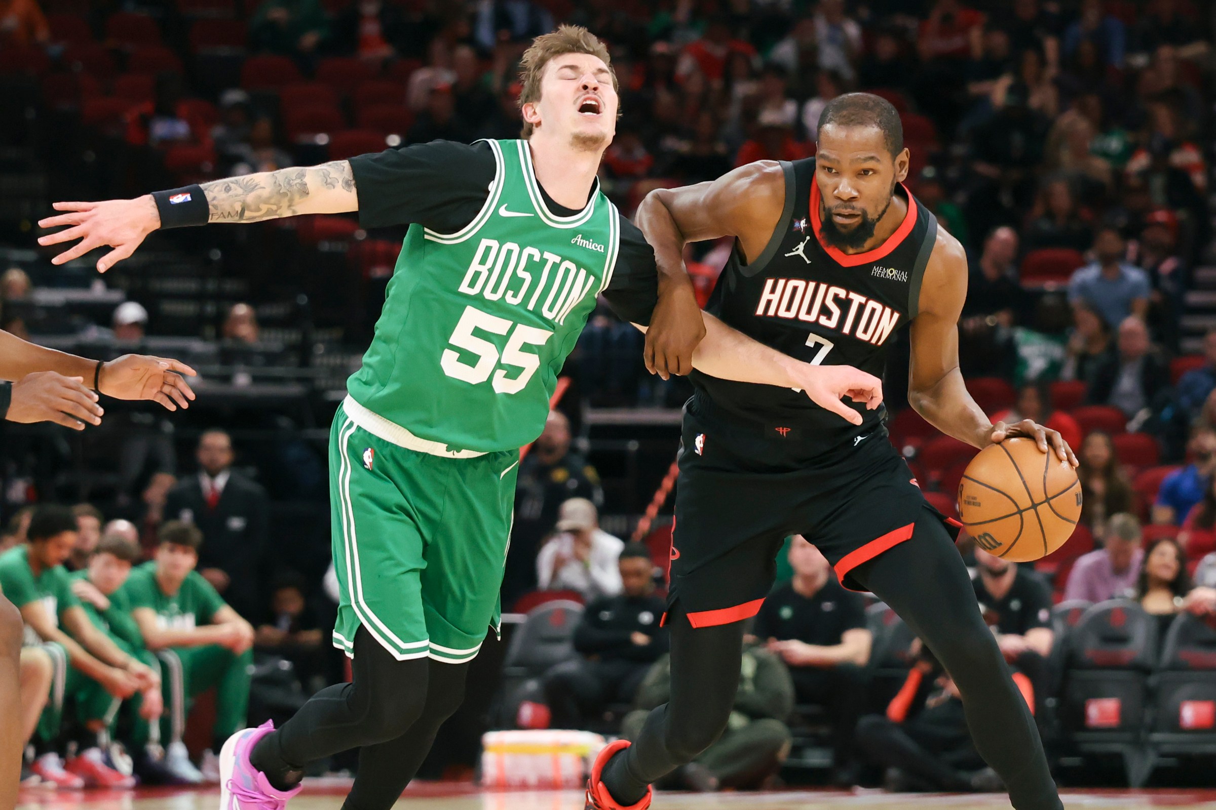 Feb 4, 2026; Houston, Texas, USA; Houston Rockets forward Kevin Durant (7) dribbles the ball as Boston Celtics guard Baylor Scheierman (55) defends during the first quarter at Toyota Center. Mandatory Credit: Troy Taormina-Imagn Images