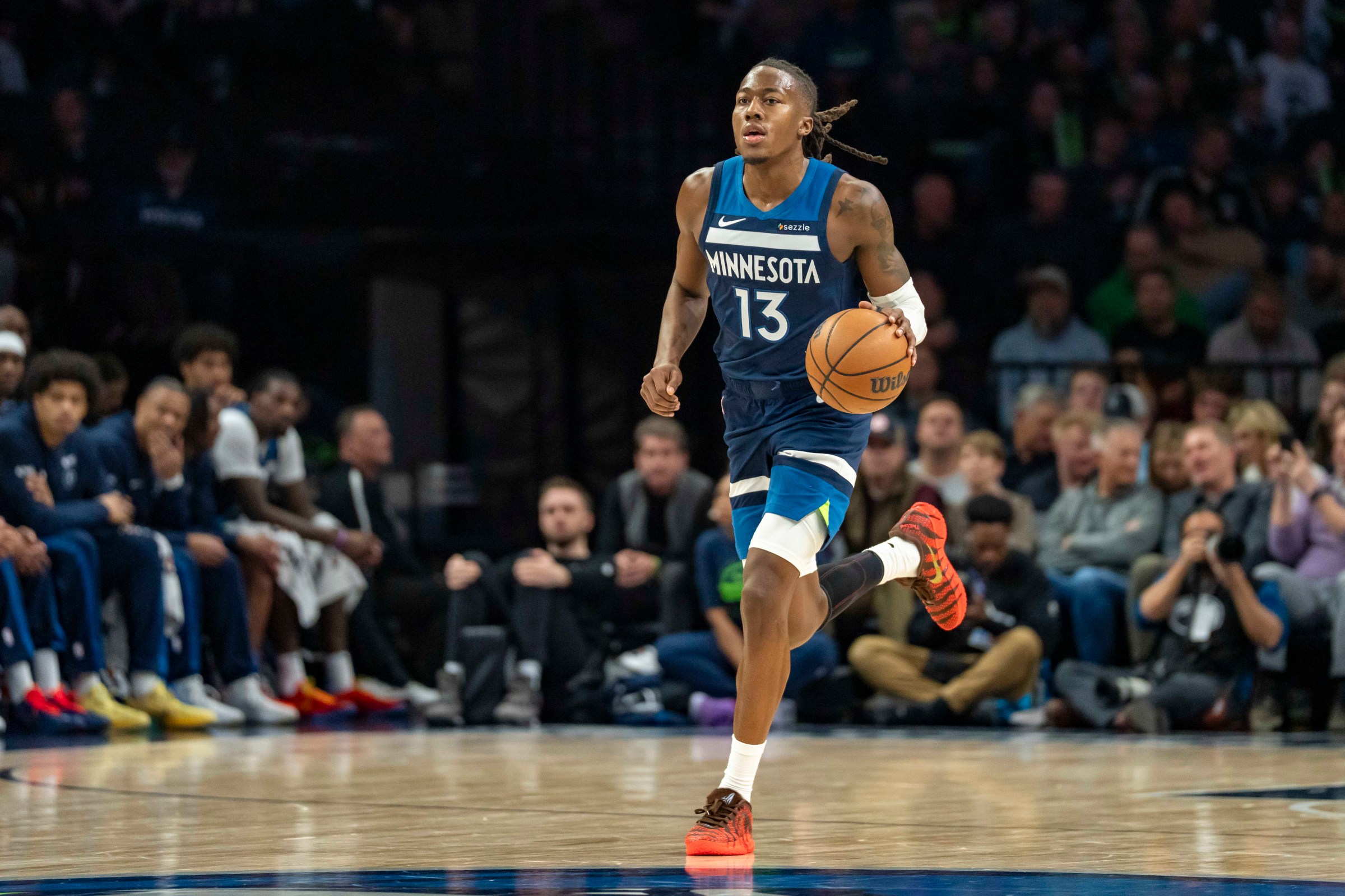 Feb 11, 2026; Minneapolis, Minnesota, USA; Minnesota Timberwolves guard Ayo Dosunmu (13) dribbles the ball against the Portland Trail Blazers in the second half at Target Center. Mandatory Credit: Jesse Johnson-Imagn Images