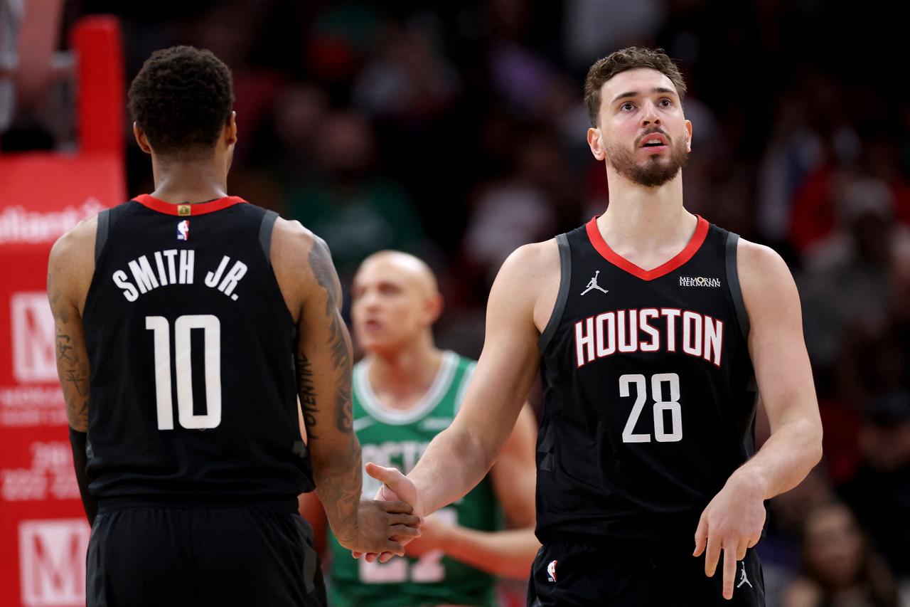 Jabari Smith Jr. #10 of the Houston Rockets congratulates Alperen Sengun #28 in the first half against the Boston Celtics on Feb. 4, 2026 in Houston, Texas. (Photo by Tim Warner/Getty Images North America/Getty Images via AFP)