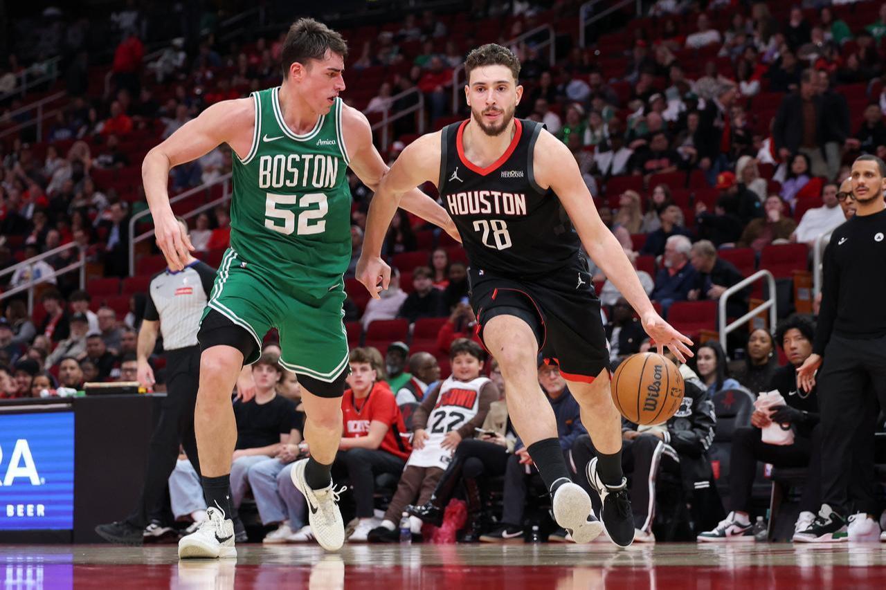 Luka Garza #52 of the Boston Celtics defends Alperen Sengun #28 of the Houston Rockets in the second half on Feb. 4, 2026 in Houston, Texas. (Photo by Tim Warner/Getty Images North America/Getty Images via AFP)