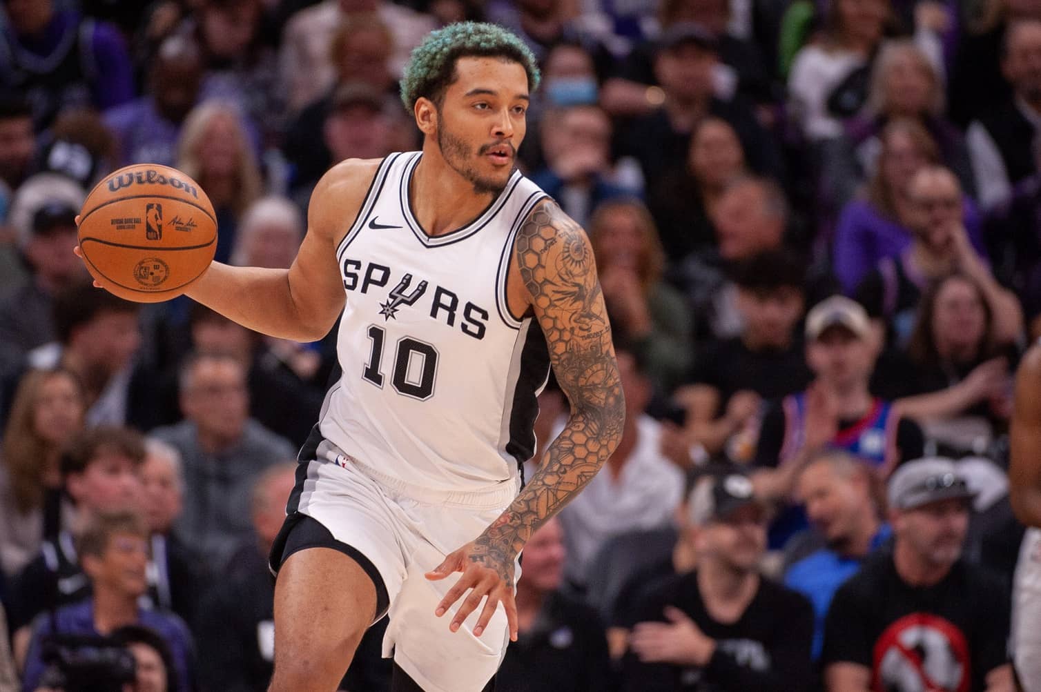Mar 7, 2025; Sacramento, California, USA; San Antonio Spurs forward Jeremy Sochan (10) pushes the ball up the court during the fourth quarter of the game against the Sacramento Kings at Golden 1 Center. Mandatory Credit: Ed Szczepanski-Imagn Images