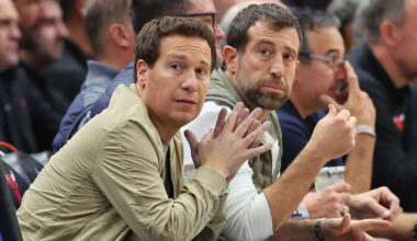 Owners Mat Ishbia and Justin Ishbia of the Phoenix Suns look on during the first half between the C...