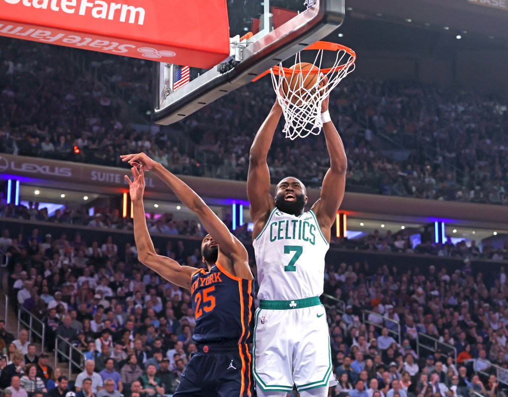 Boston Celtics guard Jaylen Brown #7 slams the ball during a game against the New York Knicks.