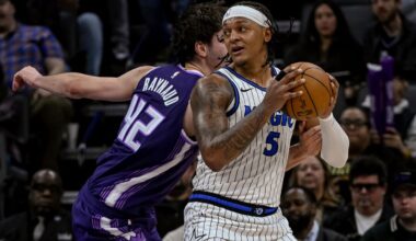 Magic forward Paolo Banchero (5) works the ball past Kings center Maxime Raynaud (42) on Thursday night in Sacramento. (AP Photo/Randall Benton)