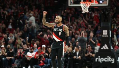 Portland Trail Blazers guard Damian Lillard (0) reacts after shooting a three-point shot over Utah Jazz in the second half at Moda Center.