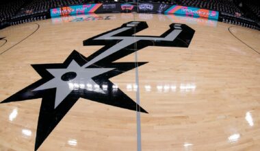 The Spurs logo at center court