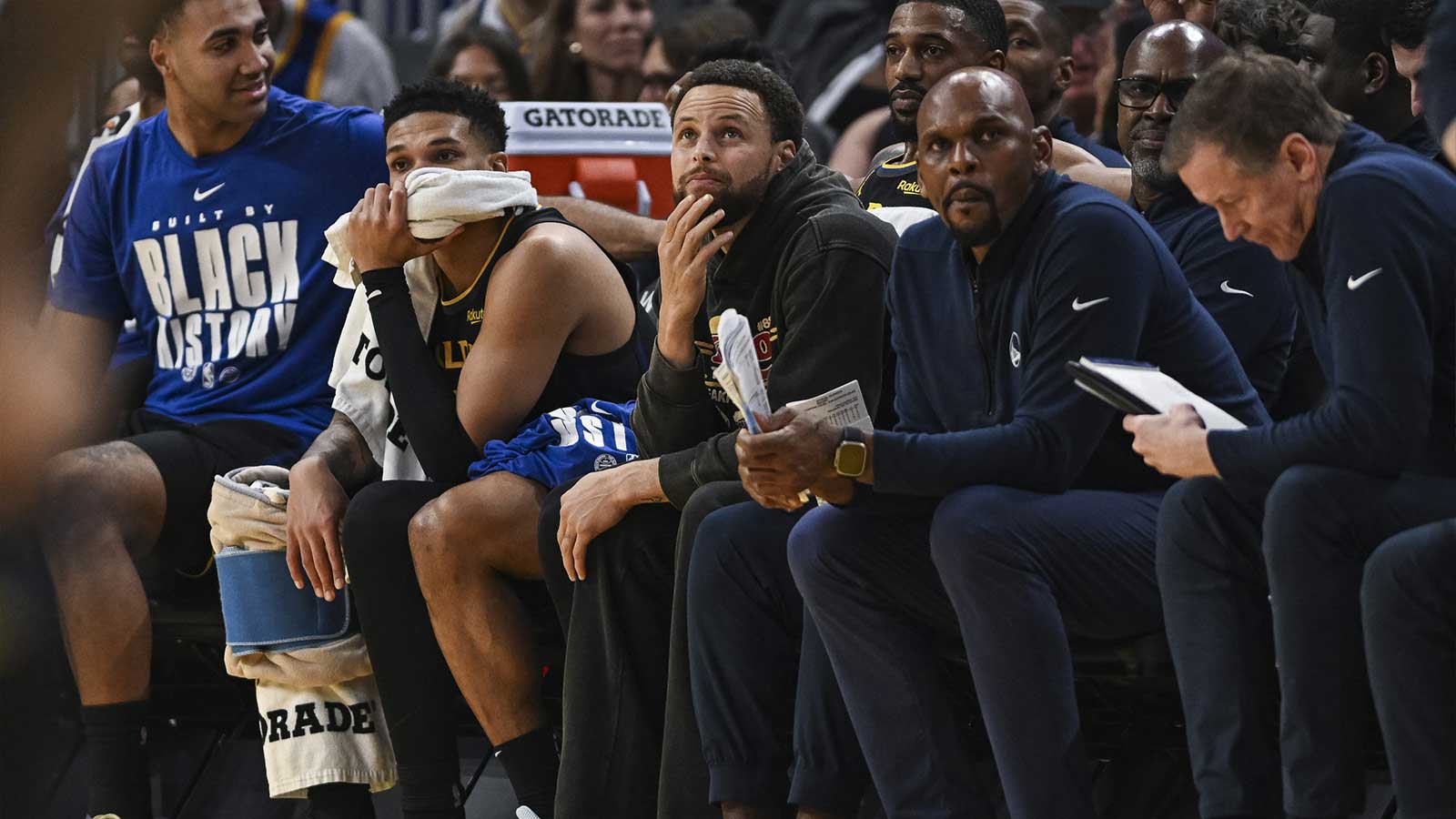 Golden State Warriors guard Stephen Curry (30) looks on from the bench during the second period against the Philadelphia 76ers at Chase Center.