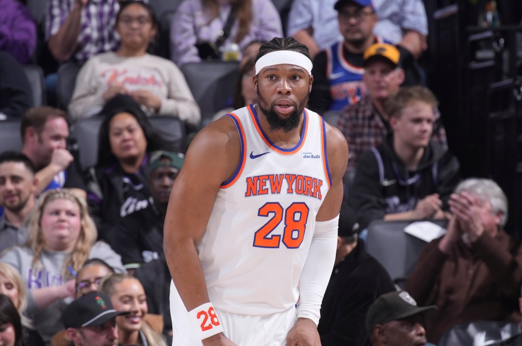 New York Knicks player Guerschon Yabusele #28 looking on during a game.