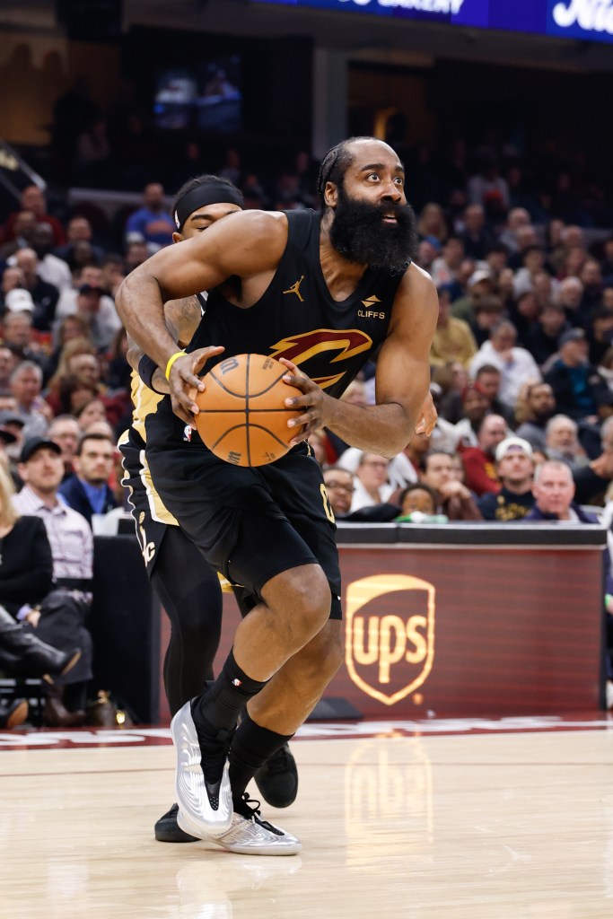 James Harden of the Cleveland Cavaliers drives to the basket with a basketball.
