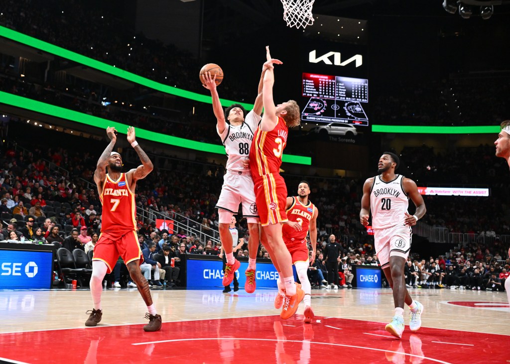Nolan Traore of the Brooklyn Nets drives to the basket against the Atlanta Hawks.