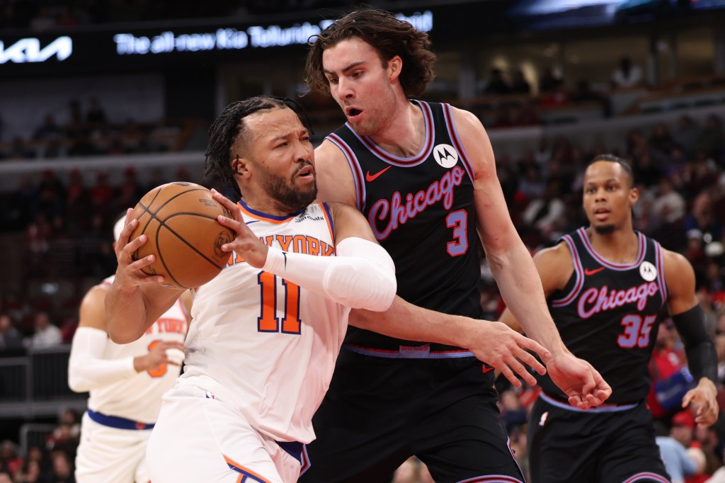 Jalen Brunson dribbles past Josh Giddey during the New York Knicks v Chicago Bulls game.