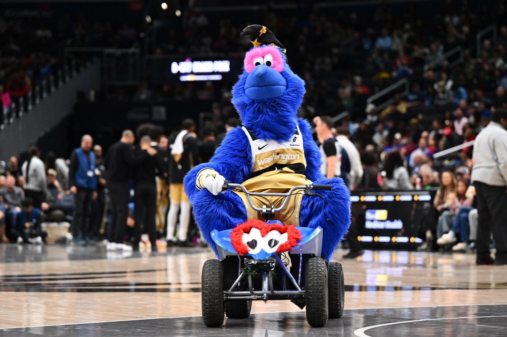 Washington Wizards mascot G-Wiz on a quad bike.