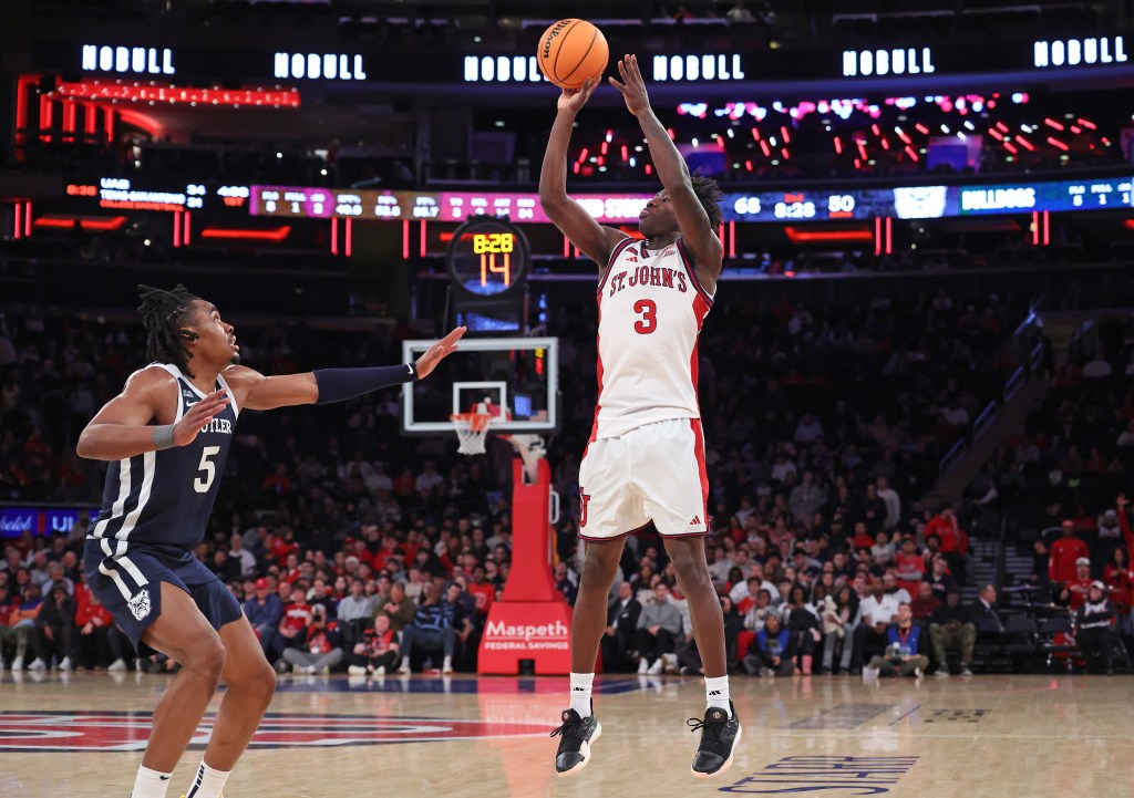 St. John's Red Storm guard Joson Sanon #3 puts up a shot over Butler Bulldogs forward Michael Ajayi #5 during the second half.