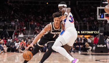 Mar 7, 2026; Atlanta, Georgia, USA; Atlanta Hawks forward Jalen Johnson (1) dribbles into Philadelphia 76ers forward Adem Bona (30) during the second half at State Farm Arena. Mandatory Credit: Dale Zanine-Imagn Images