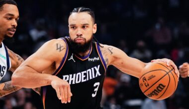 Phoenix Suns guard/forward Dillon Brooks drives the ball against Dallas Mavericks forward P.J. Washington during the first half the game at Mortgage Matchup Center.