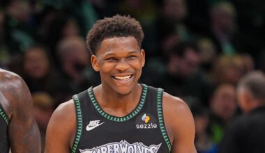 Feb 9, 2026; Minneapolis, Minnesota, USA; Minnesota Timberwolves forward Julius Randle (30) and guard Anthony Edwards (5) laugh after a timeout against the Atlanta Hawks in the fourth quarter at Target Center. Mandatory Credit: Brad Rempel-Imagn Images