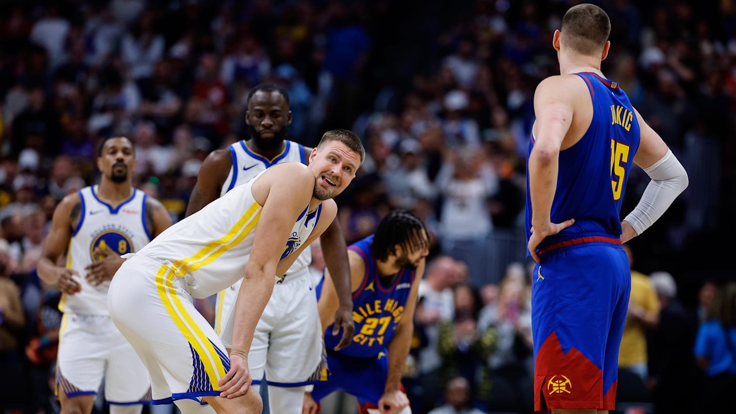Mar 29, 2026; Denver, Colorado, USA; Golden State Warriors center Kristaps Porzingis (7) and Denver Nuggets center Nikola Jokic (15) before tip off at Ball Arena. Mandatory Credit: Isaiah J. Downing-Imagn Images