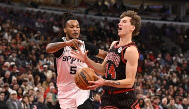 Nov 10, 2025; Chicago, Illinois, USA;  Chicago Bulls forward Matas Buzelis (14) is fouled by San Antonio Spurs guard Stephon Castle (5) during the first half at United Center. Mandatory Credit: Matt Marton-Imagn Images