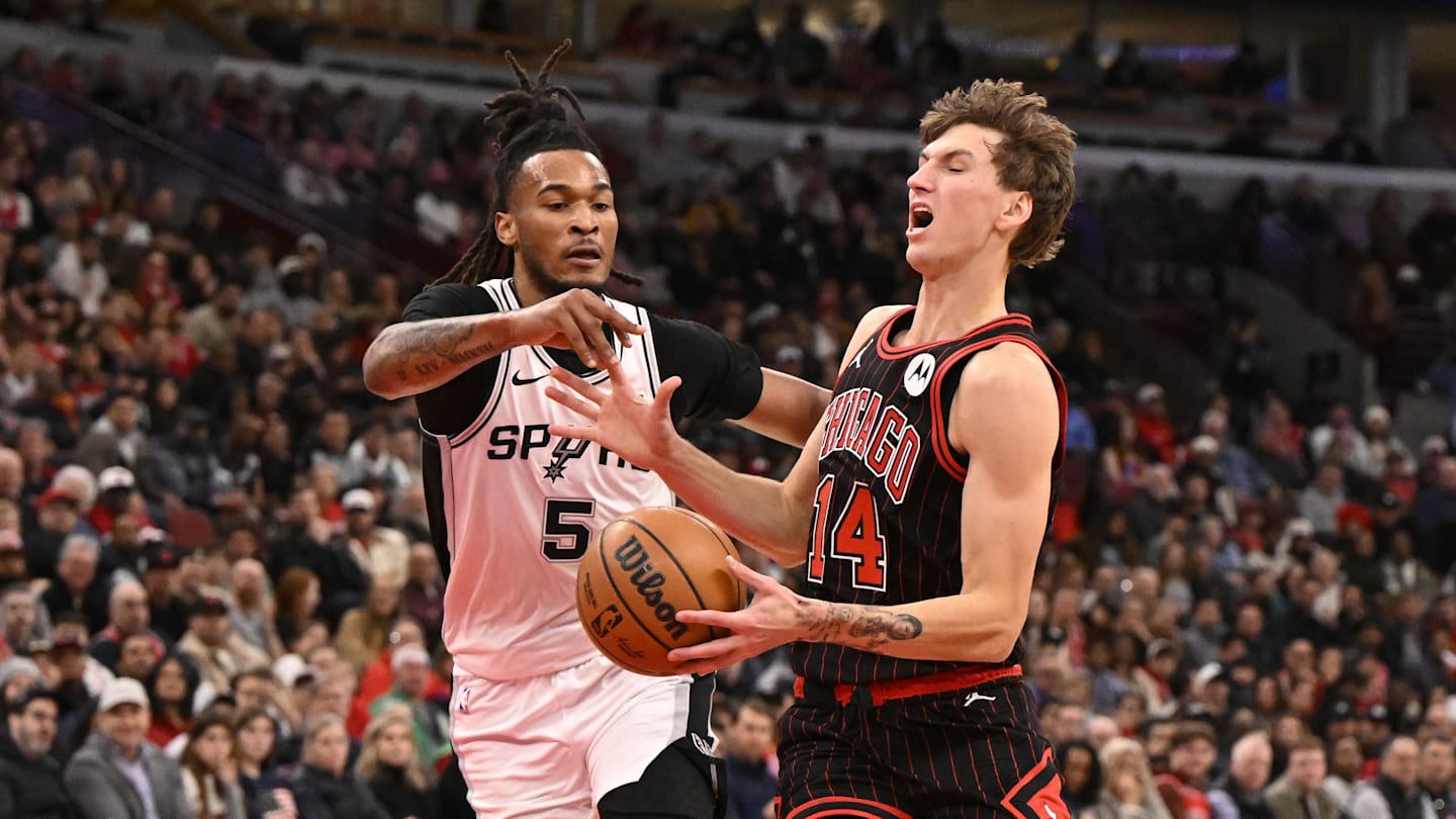 Nov 10, 2025; Chicago, Illinois, USA;  Chicago Bulls forward Matas Buzelis (14) is fouled by San Antonio Spurs guard Stephon Castle (5) during the first half at United Center. Mandatory Credit: Matt Marton-Imagn Images