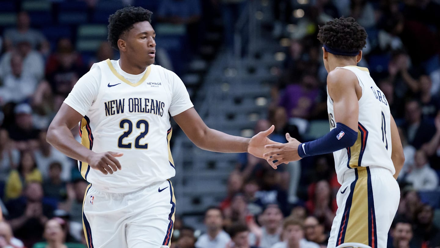 Dec 26, 2025; New Orleans, Louisiana, USA;  New Orleans Pelicans center Derik Queen (22) celebrates a basket with guard Jeremiah Fears (0) during the first half against the Phoenix Suns at Smoothie King Center. Mandatory Credit: Matthew Hinton-Imagn Images