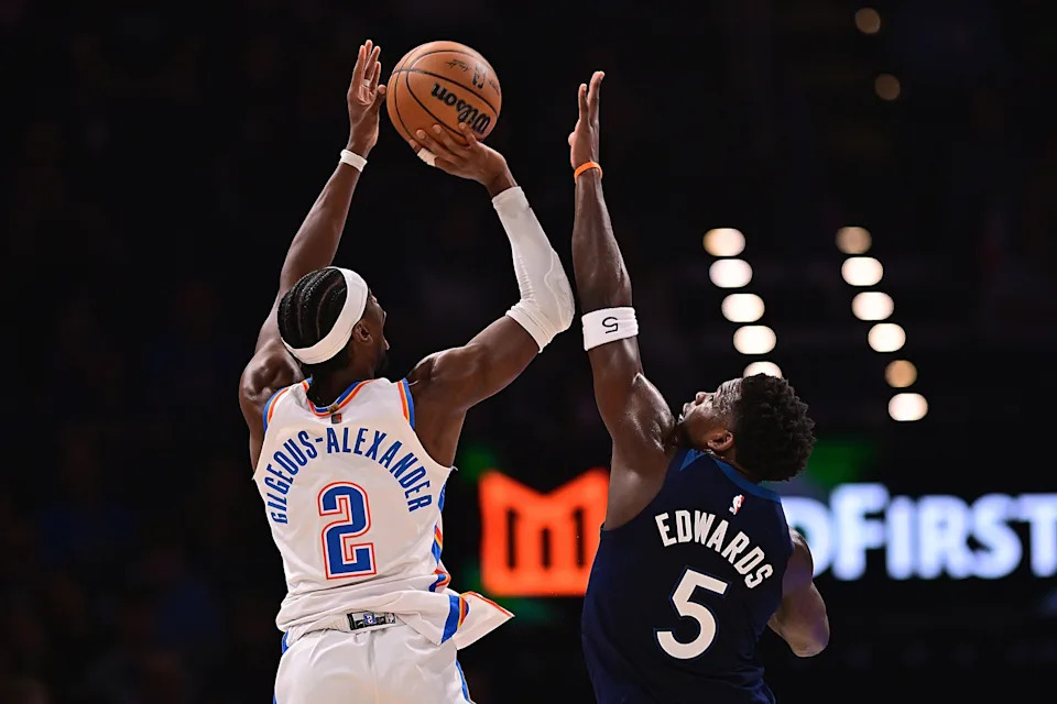 OKLAHOMA CITY, OKLAHOMA - MARCH 15: Shai Gilgeous-Alexander #2 of the Oklahoma City Thunder attempts a shot in front of Anthony Edwards #5 of the Minnesota Timberwolves at Paycom Center on March 15, 2026 in Oklahoma City, Oklahoma. NOTE TO USER: User expressly acknowledges and agrees that, by downloading and or using this photograph, User is consenting to the terms and conditions of the Getty Images License Agreement. (Photo by Joshua Gateley/Getty Images)