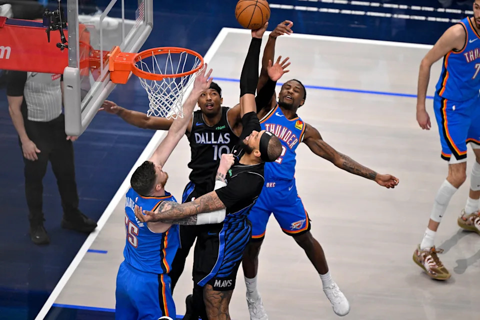 Mar 1, 2026; Dallas, Texas, USA; Oklahoma City Thunder center Isaiah Hartenstein (55) and Dallas Mavericks forward Daniel Gafford (21) battle for the rebound during the first quarter at the American Airlines Center. Mandatory Credit: Jerome Miron-Imagn Images