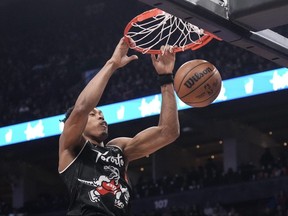 Scottie Barnes of the Toronto Raptors scores